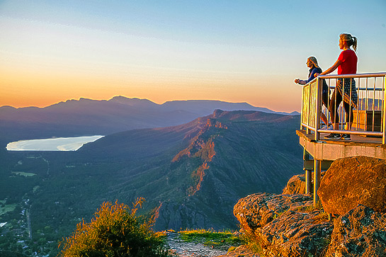 People taking in views of the Grampians from the viewing platform at Boroka Lookout, Grampians National Park, Victoria, Australia